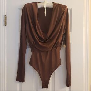 Beautiful and sexy! Cowl neck
bodysuit with shoulder pads.